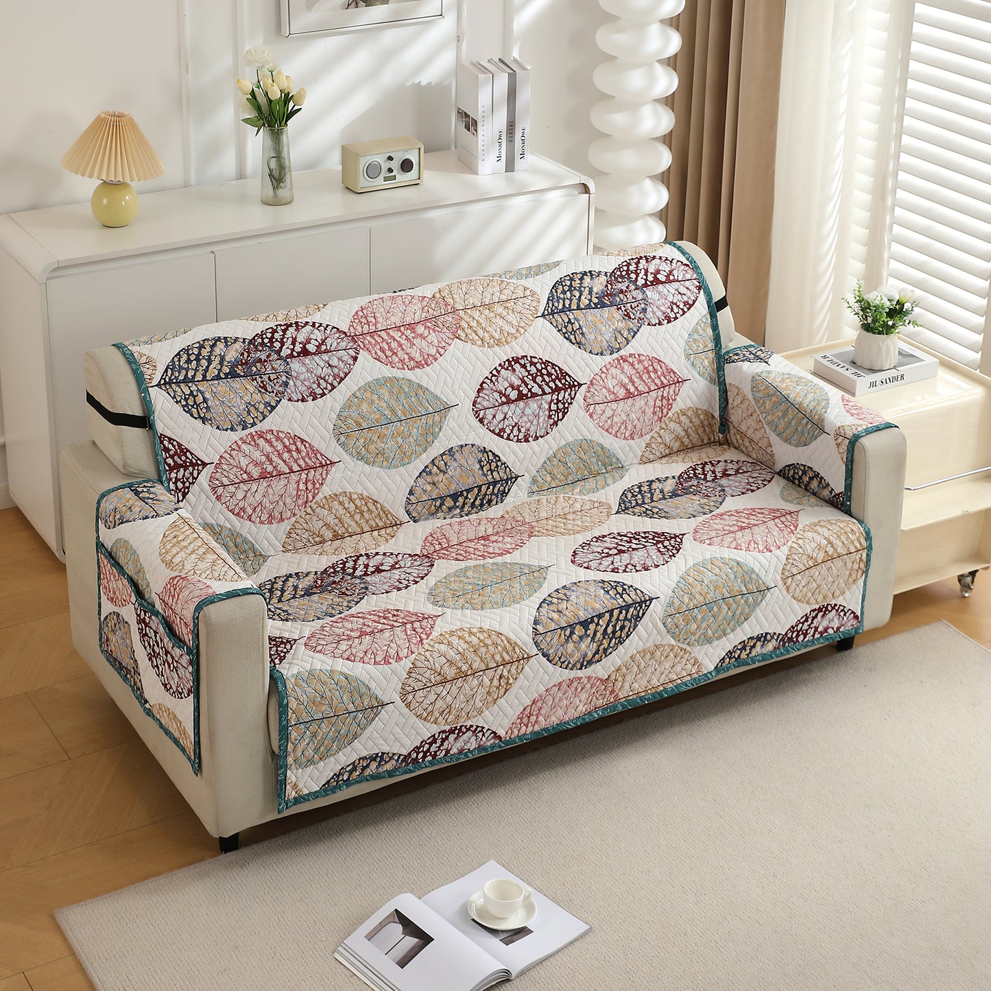 Multicolor Linden Leaf Printed quilted three seater sofa cover with armrest and side pockets