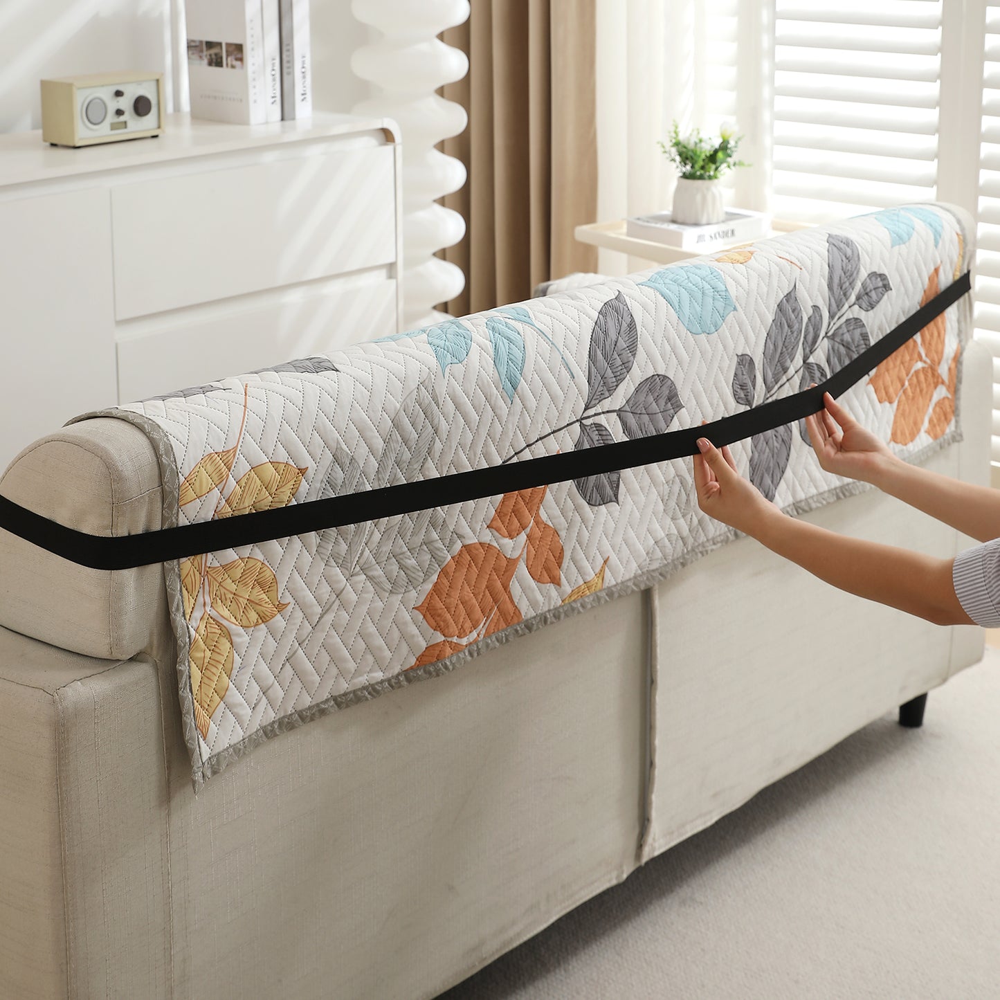 Multicolor Leaves Printed quilted sofa cover with anti slip elastic strap