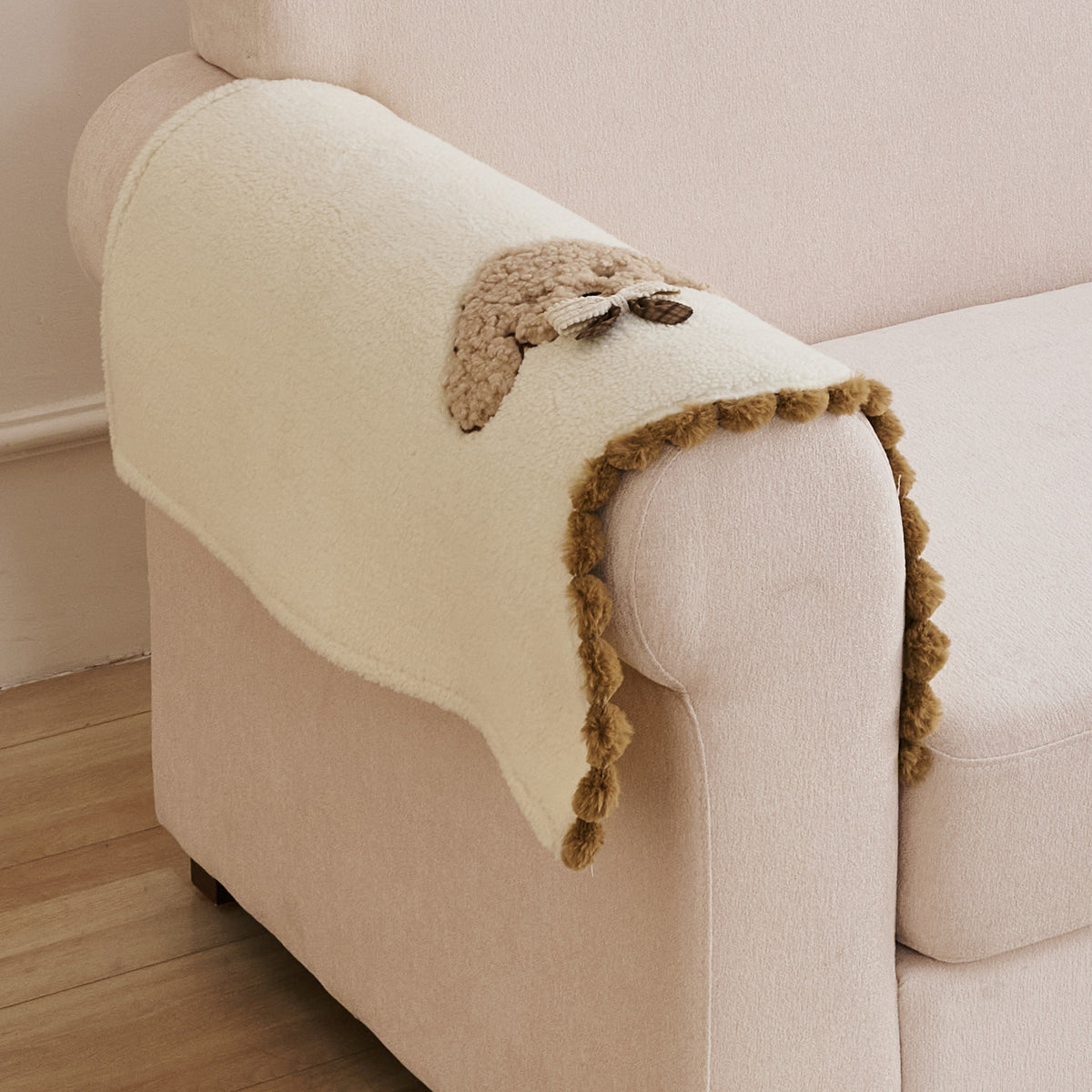 CloudHug Plush Sofa Cover Mat with PomPom and Wavy Edges, Ivory Cream