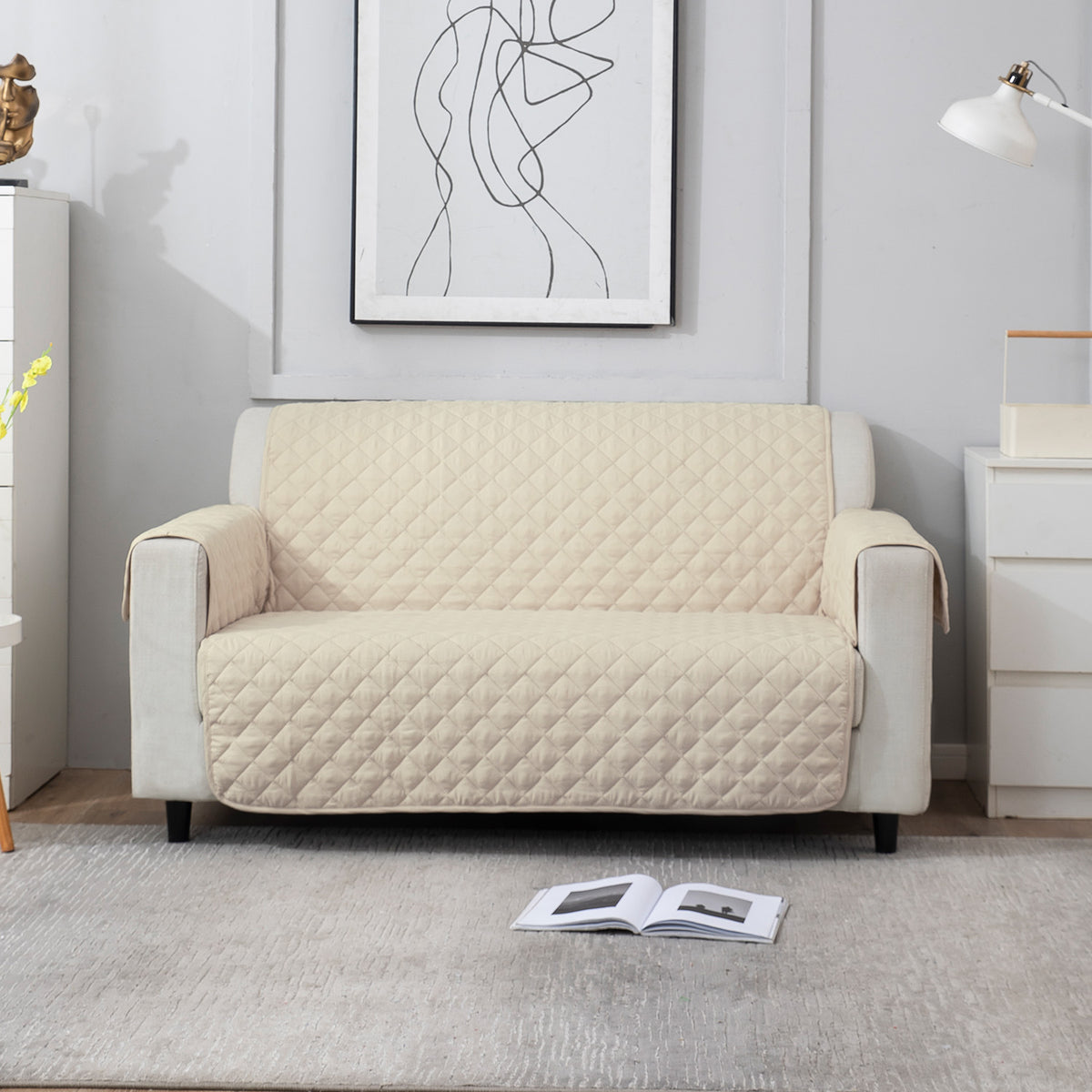 Cream quilted 2 seater sofa cover​ 