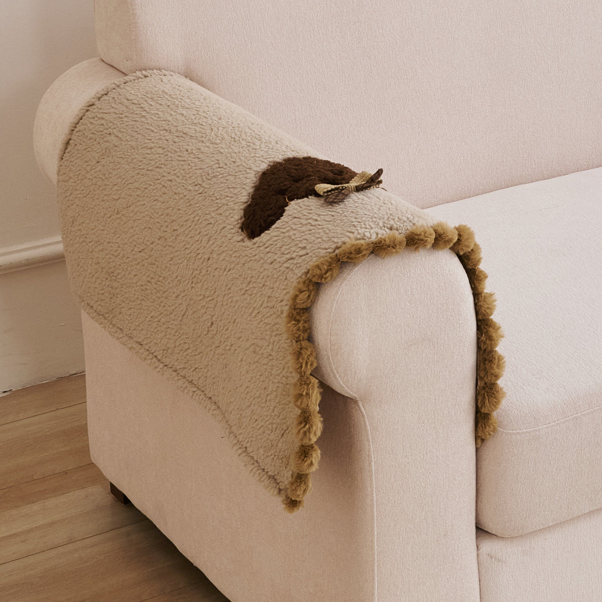 CloudHug Plush Sofa Cover Mat with PomPom and Wavy Edges, Vanilla Latte