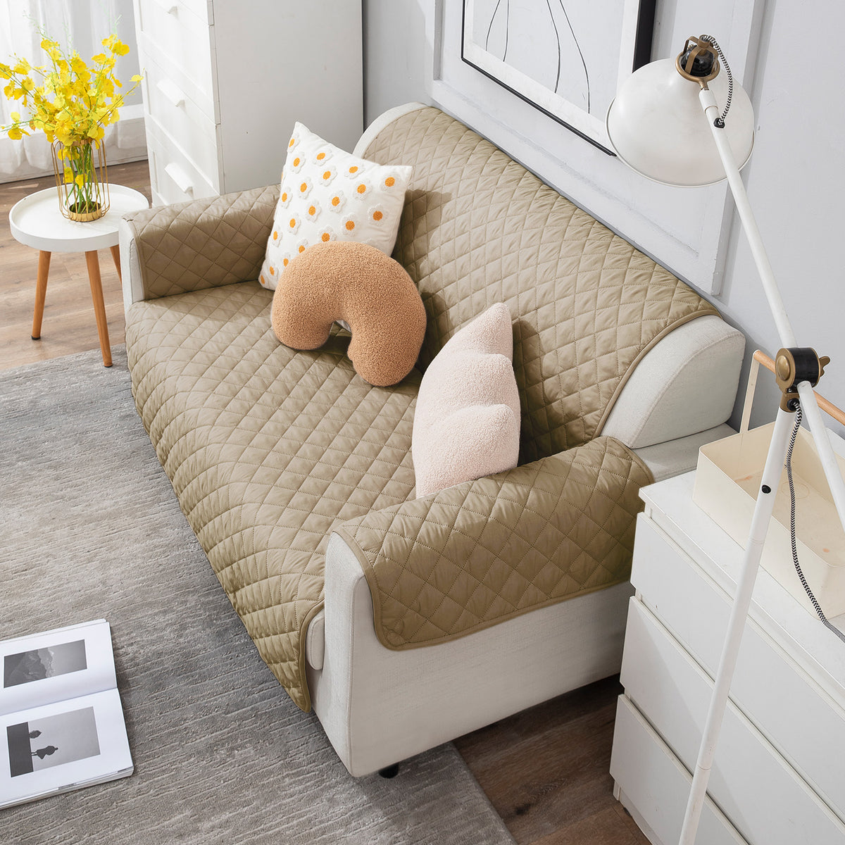 Beige quilted 2 seater sofa cover