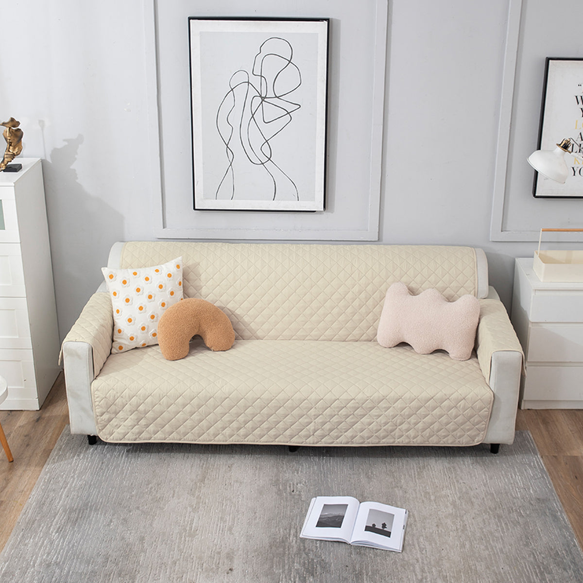 Cream quilted three seater sofa cover