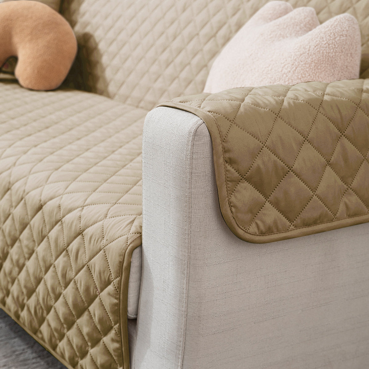 3 seater Beige quilted sofa ke cover