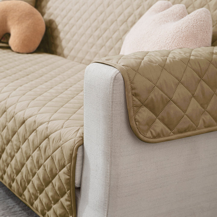 3 seater Beige quilted sofa ke cover