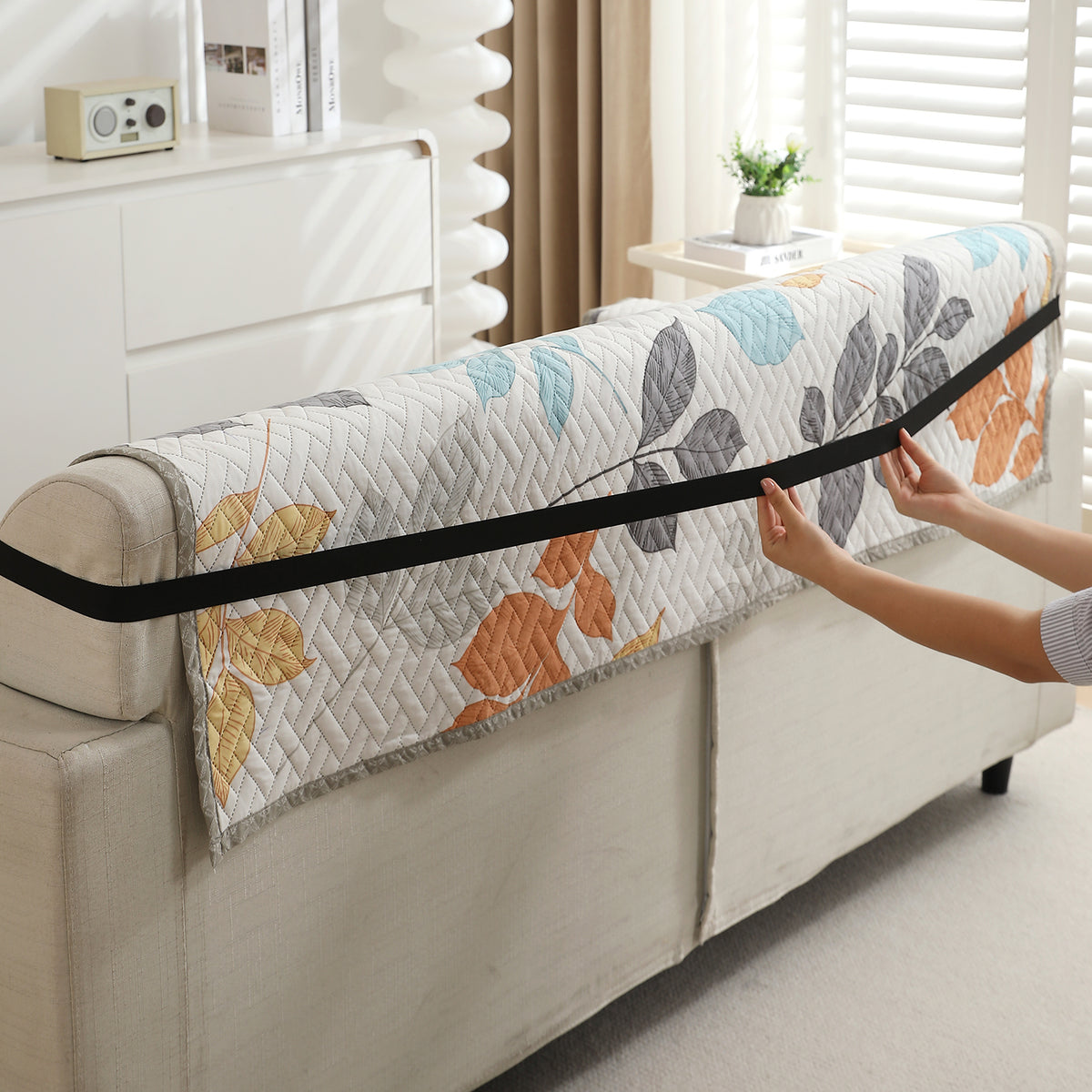 Multicolor Leaves Printed quilted sofa cover with anti slip elastic strap